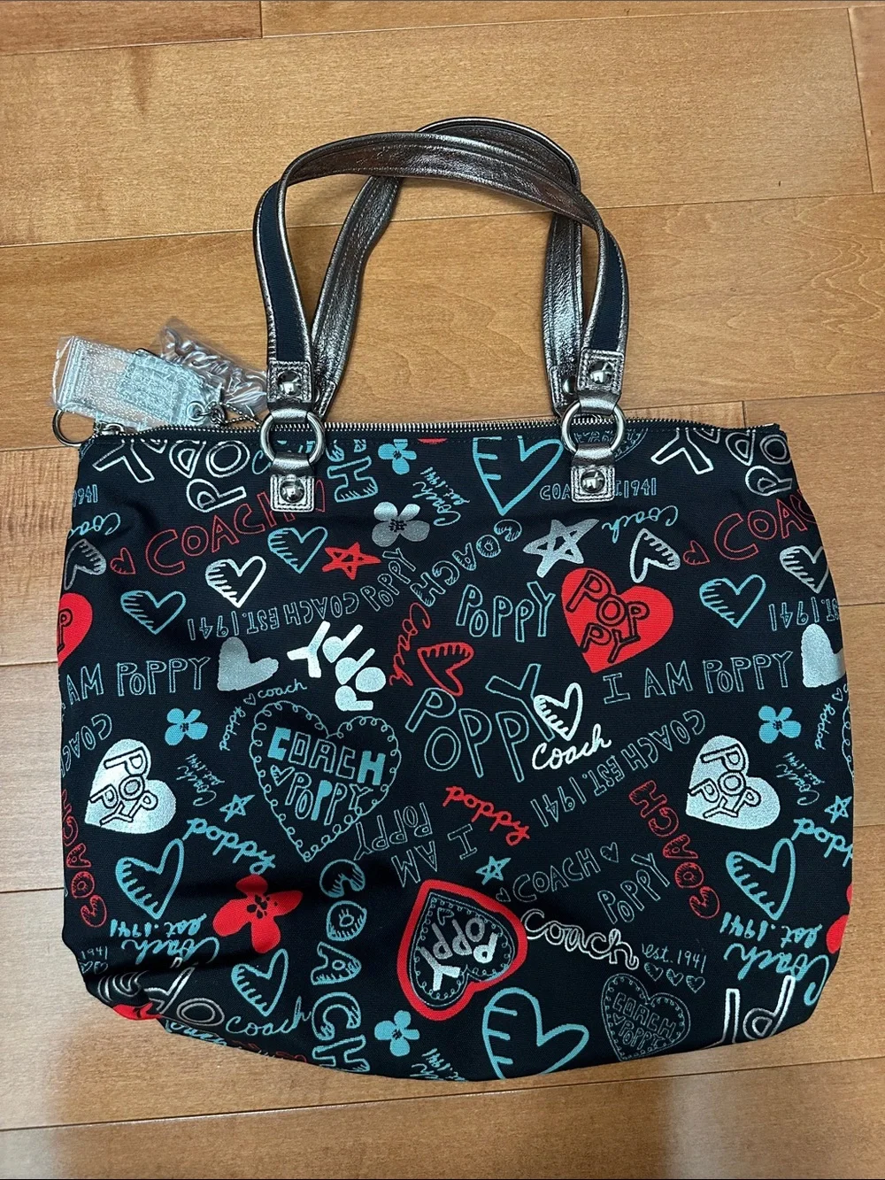 NWOT Coach Black Multi Poppy Heart Print Tote with Silver Trim